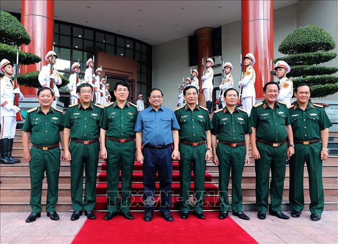 Thủ tướng Phạm Minh Chính và các đồng chí lãnh đạo Bộ Quốc phòng dự hội nghị. Ảnh: TTXVN