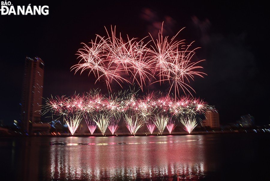 Colorful fireworks flowers displayed on the night sky