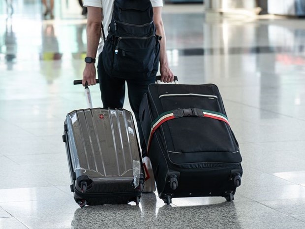 A traveller walks through the Hong Kong International Airport in China on November 29, 2021.(Photo: Bloomberg)