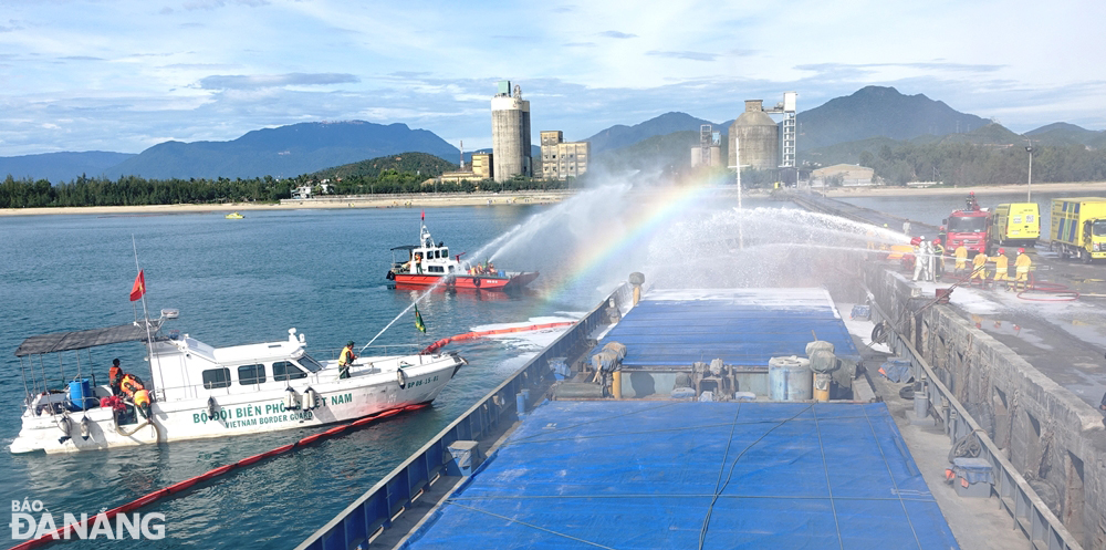 Forces and vehicles participating in fire drills on a ship arising from oil spill