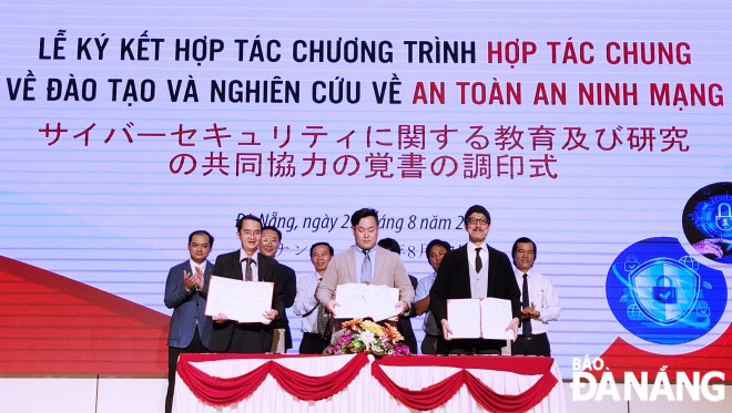 The three parties signed a cooperation agreement on cybersecurity. Photo: NGOC HA