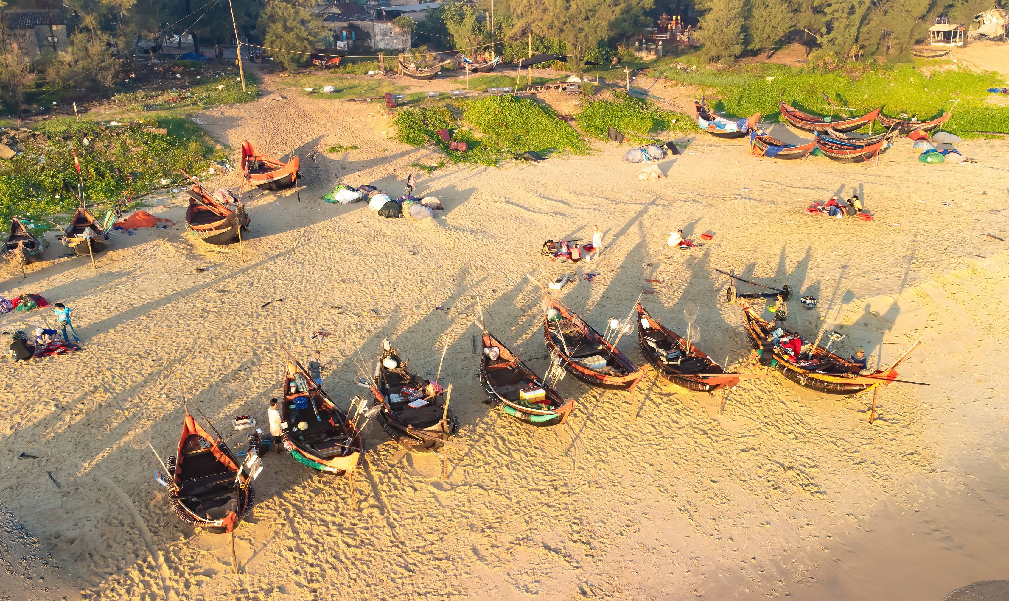 A corner of the Phu Hai fishing village with many boats preparing for night-time inshore fishing trips.