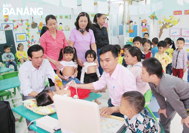 A kid undergoing a free screening test for the early detection of congenital heart complaints