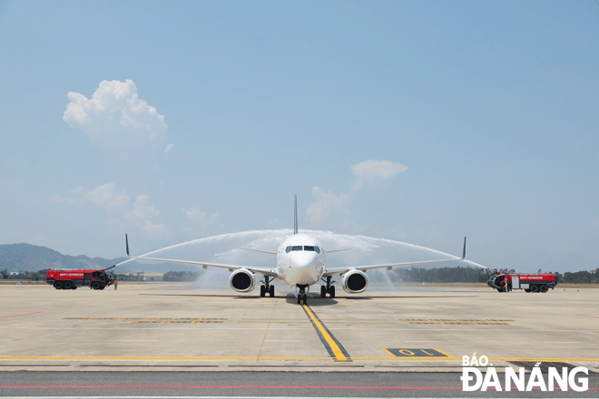 Water spraying ceremony when a Singapore Airlines flight lands at Da Nang International Airport. Photo: THU HA