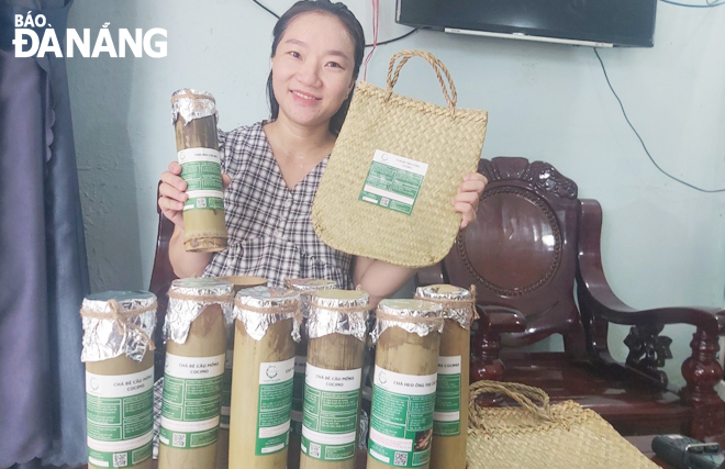  Mrs Ho Thi Nhuc with her bamboo sausage products.