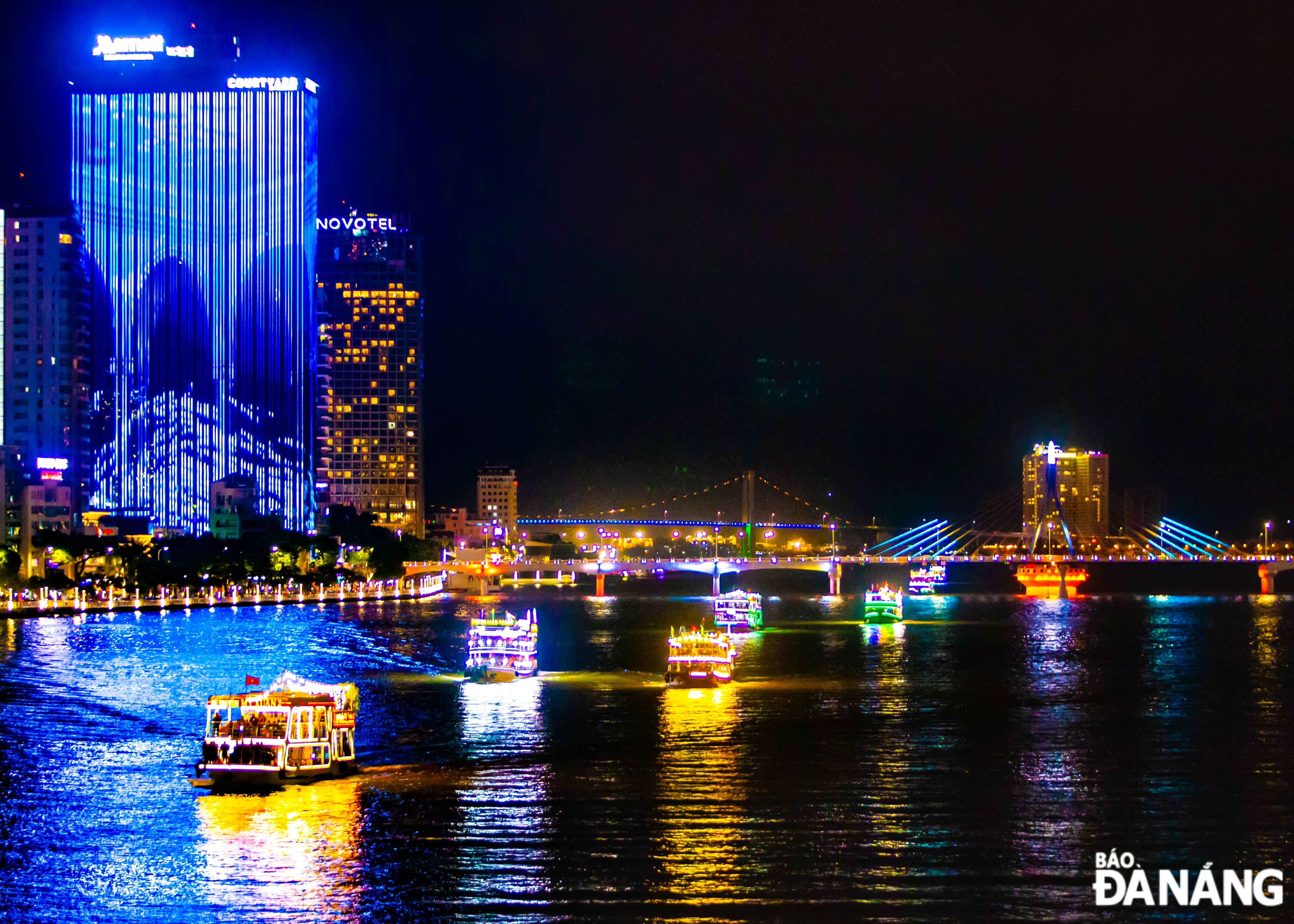 Tourists experience a boat tour on the Han River on Sunday night