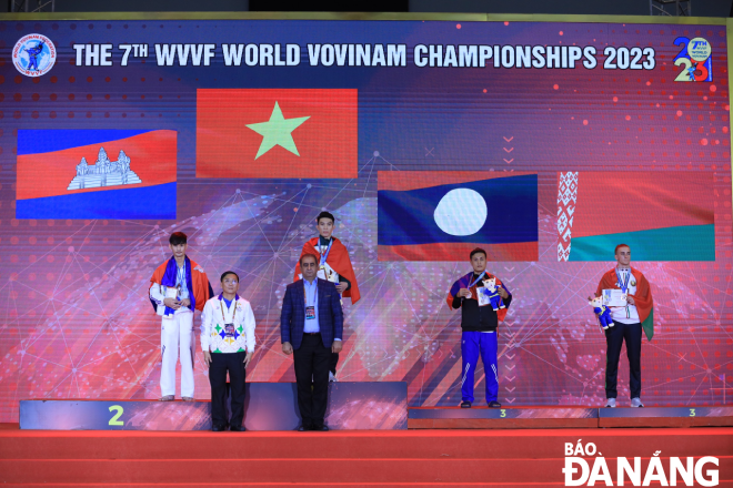 Bui Xuan Nhat (back row, second from left) on the podium at the 7th World Vovinam Championship 2023