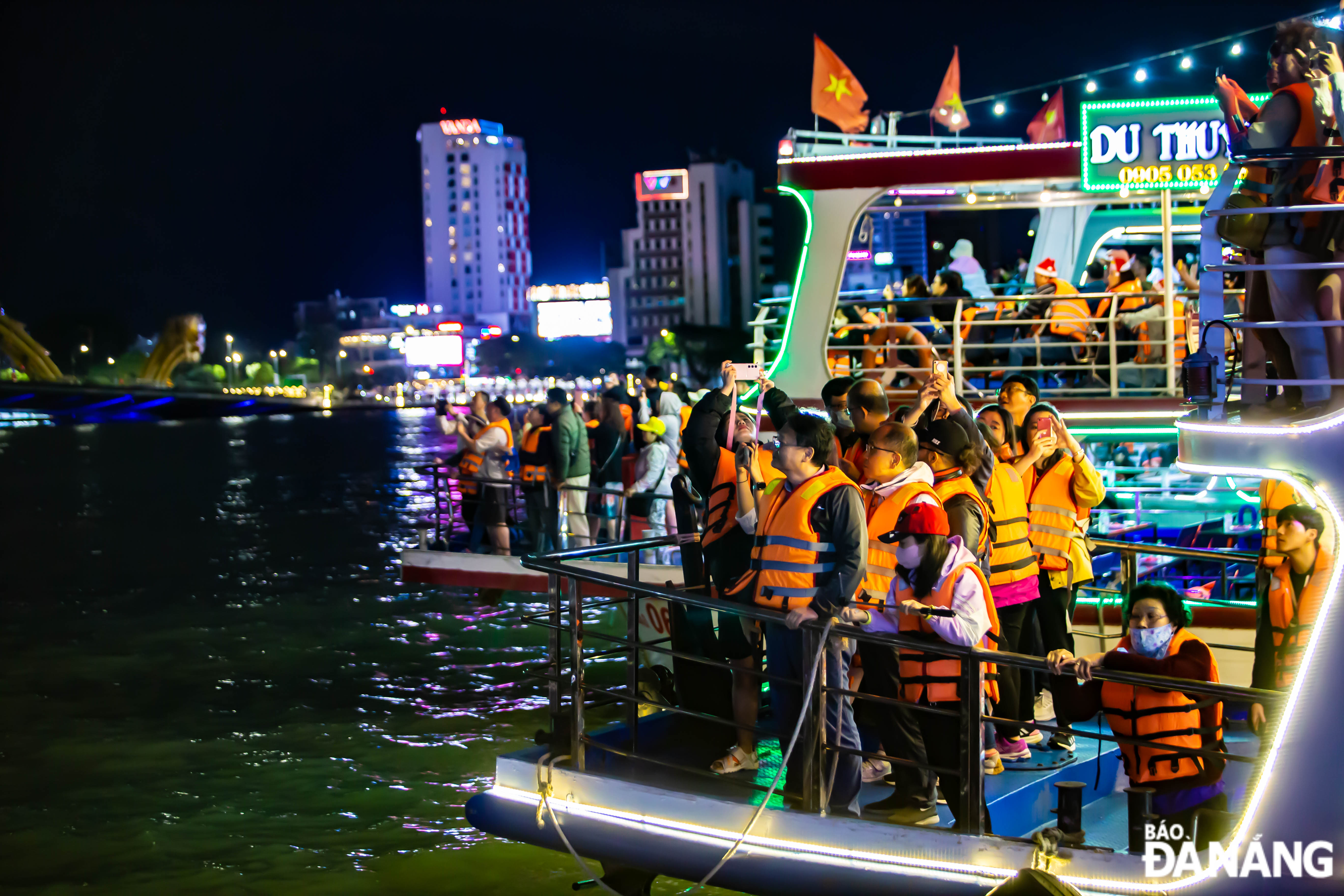 Tourists on boat tours on the Han River wearing life jackets