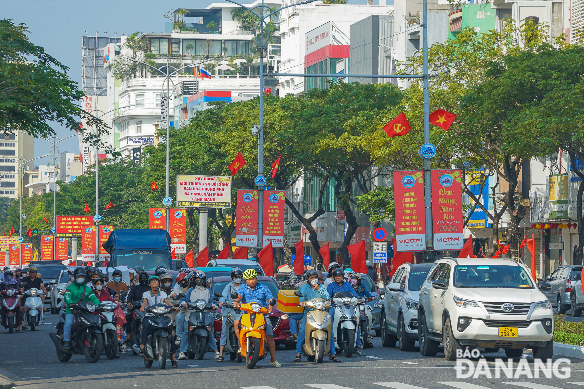 ... Vietnamese national flags, banners, panels, and slogans.