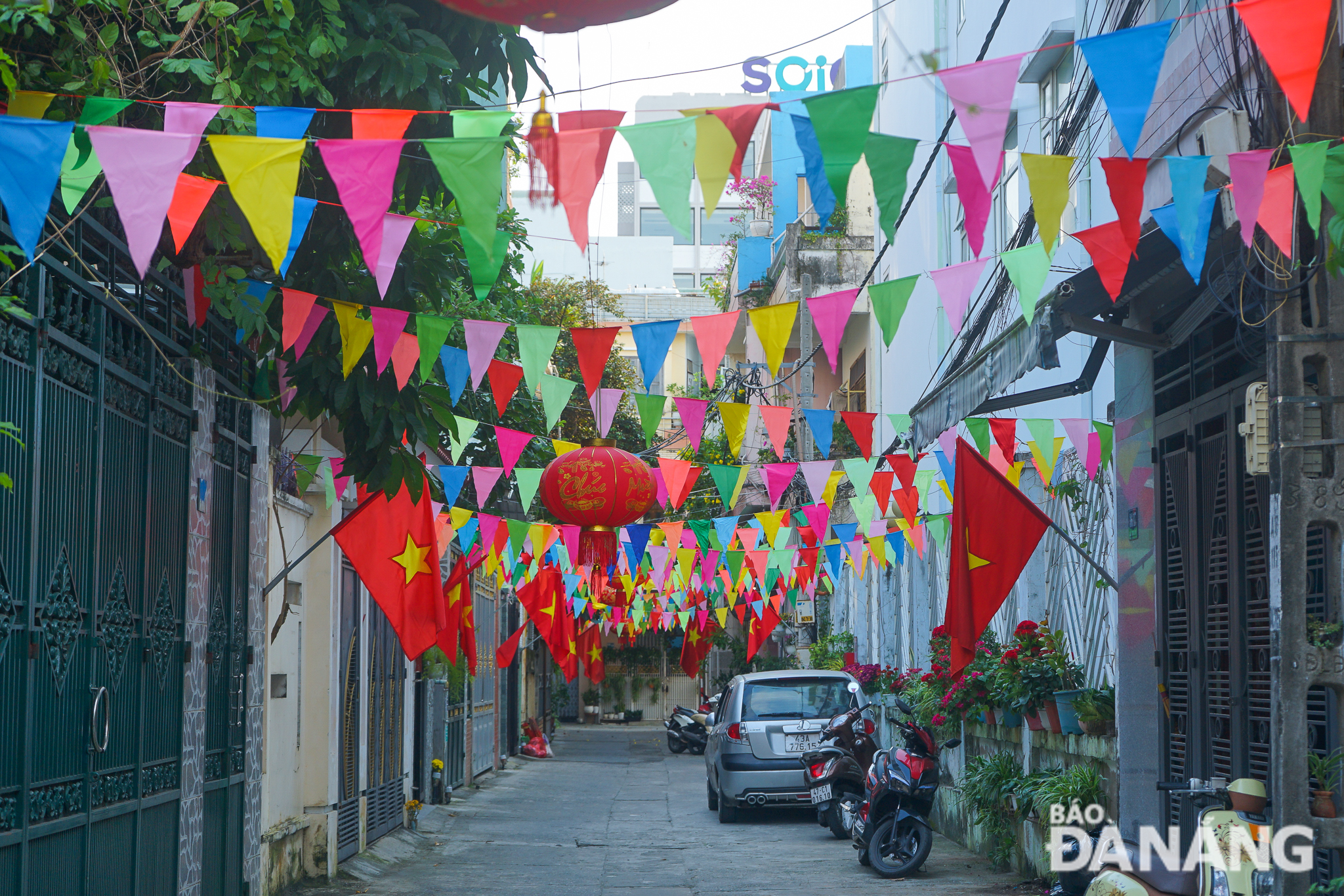 National flags, and other colourful flags, have been colouring local alleys