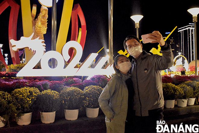 A couple hangs out together for Lunar New Year's Eve celebrations