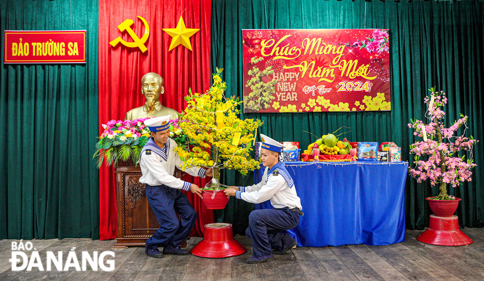 Navy soldiers decorating to prepare for Lunar New Year 2024.
