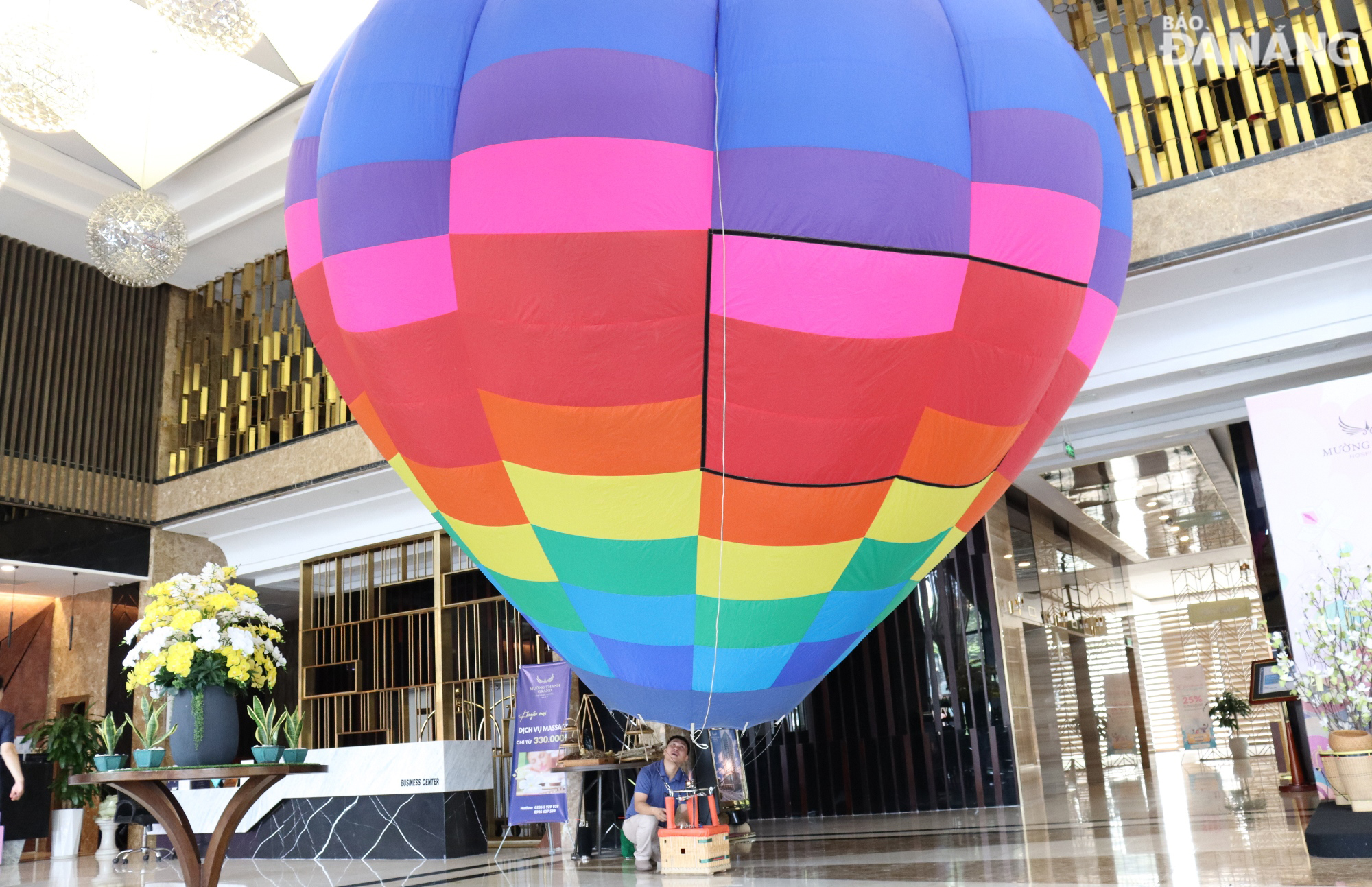 A hot air balloon model is introduced on the sidelines of the event