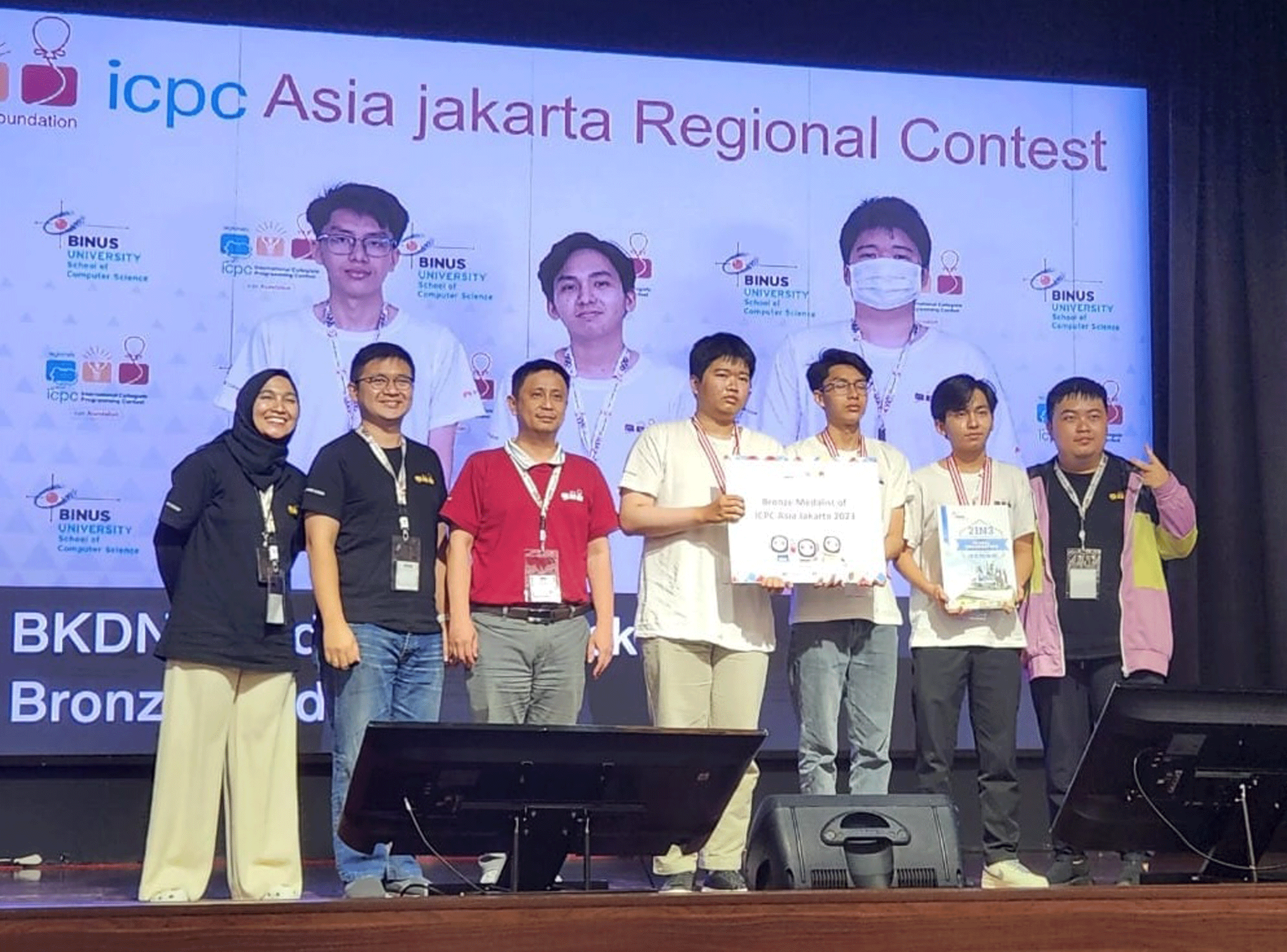 Bao An, Dinh Khoi and Bao Anh (white T-shirts, from left) at the ICPC Asia 2023 in Jakarta, Indonesia. Photo courtesy of characters.