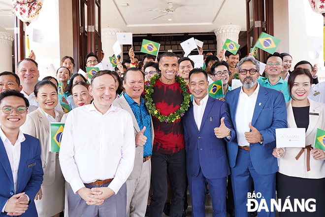 Rivaldo (in red T-shirt) receives a warm welcome at the Furama Resort Da Nang.