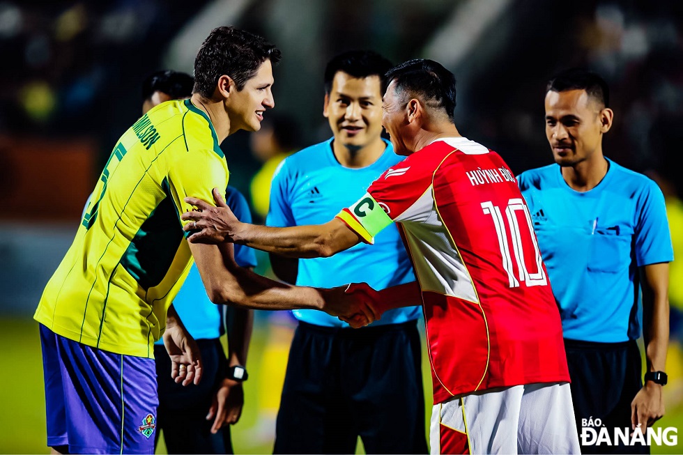 The captains of Brazil and Viet Nam shake hands before the match.