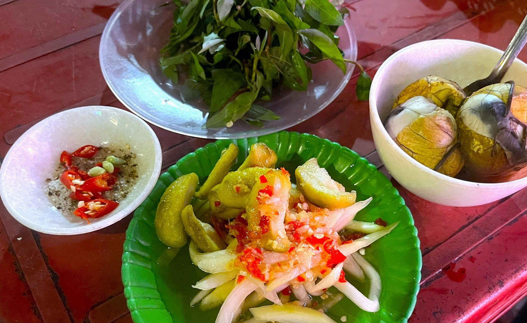 Duck eggs served with pepper salt, laksa leaves and ginger fish sauce