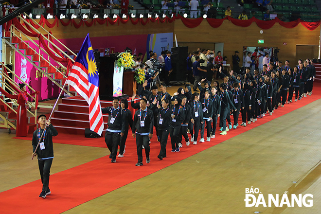 The participating sports delegations parading at the opening ceremony