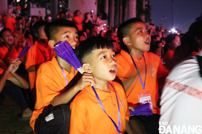 The children continuously express their joy and excitement at seeing fireworks at a close distance for the first time.