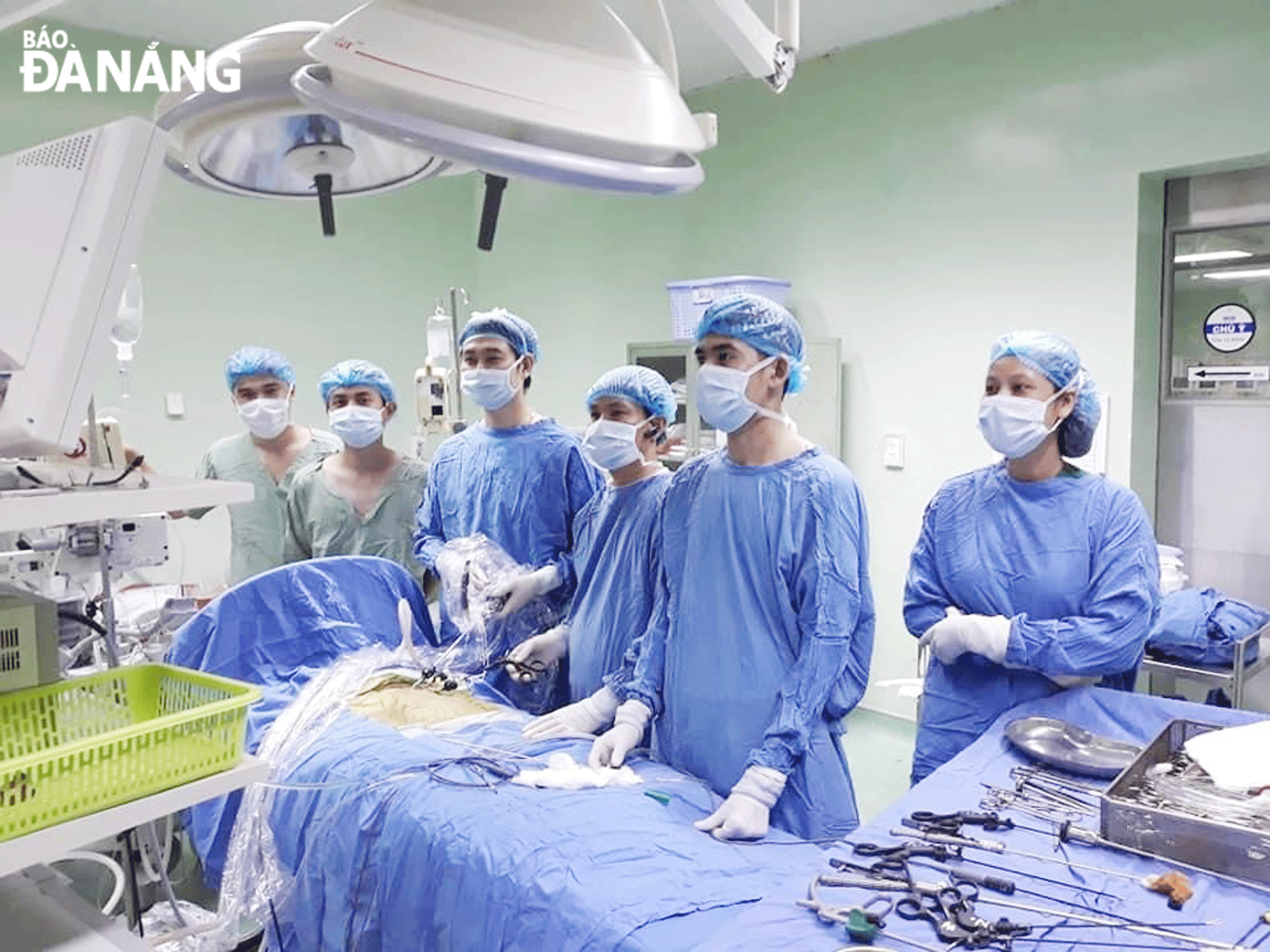 A team of doctors at the Da Nang Paediatrics and Maternity Hospital perform surgery on a baby patient. Photo: PHAN CHUNG