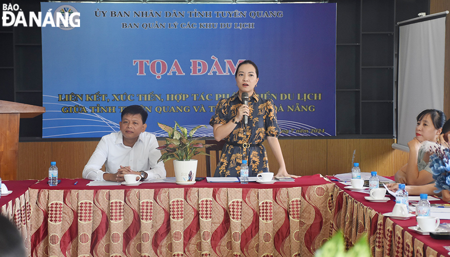 A representative of the Da Nang Department of Tourism speaking at the event