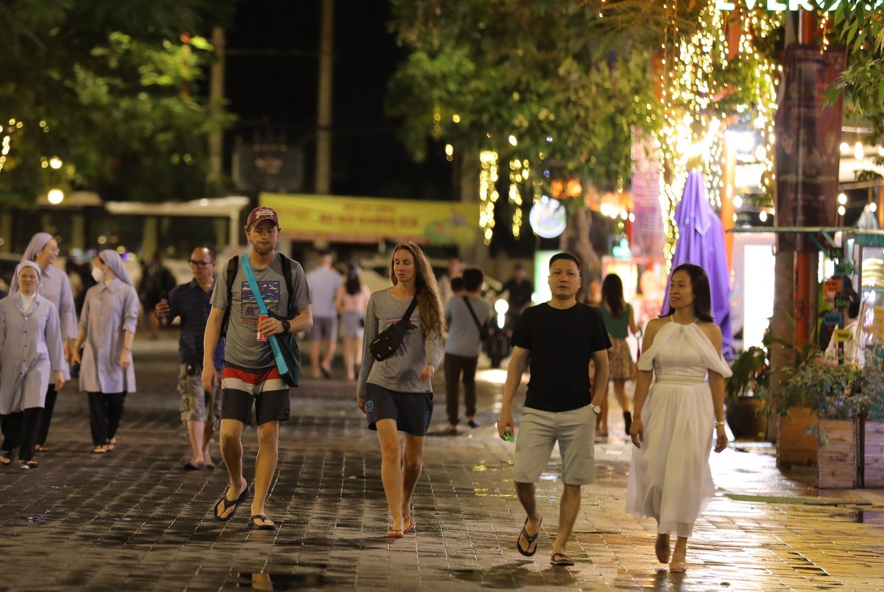 Foreign tourists are seen walking in the An Thuong Tourist Streets quarter 