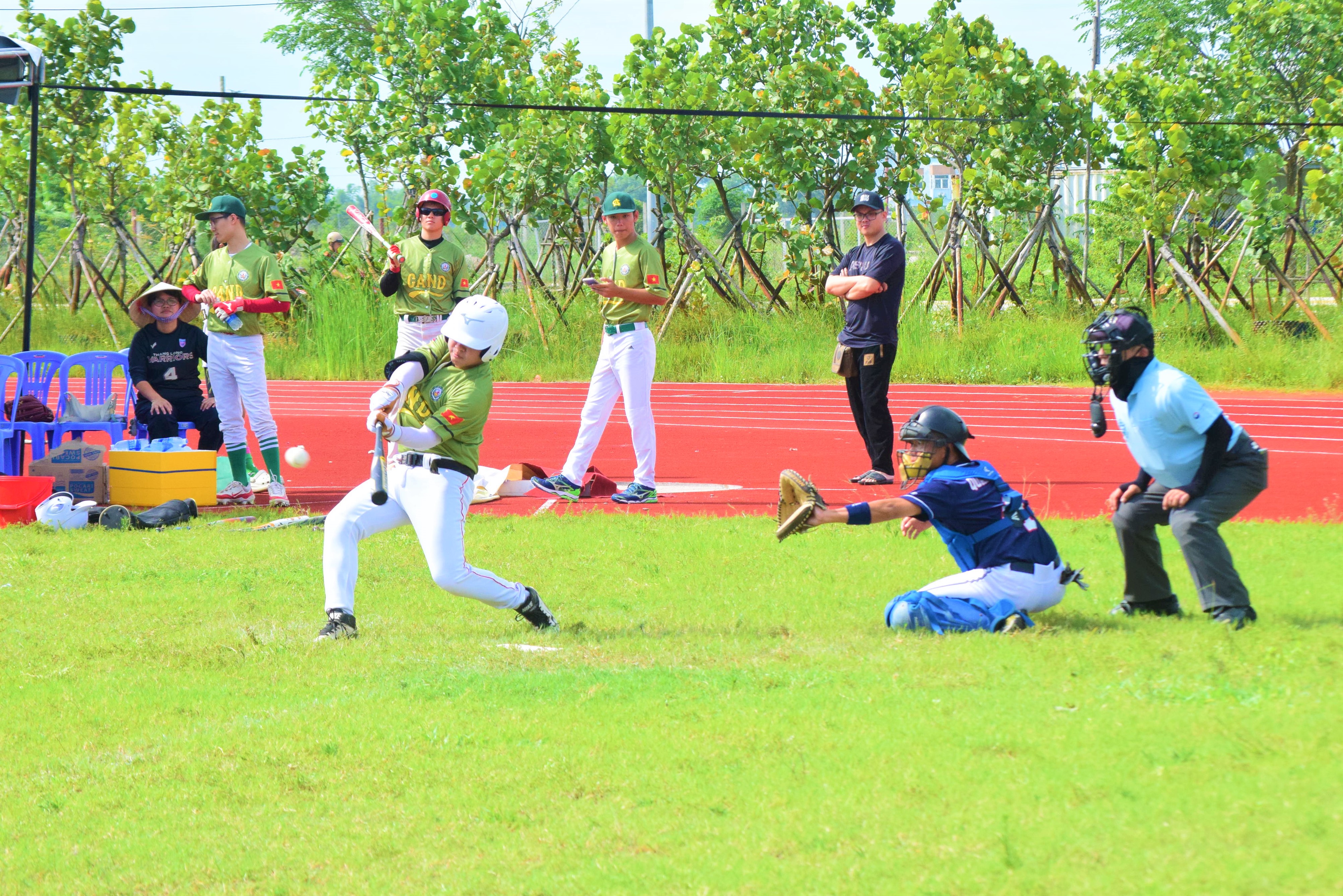 An action shot from the baseball match. Photo: P.N