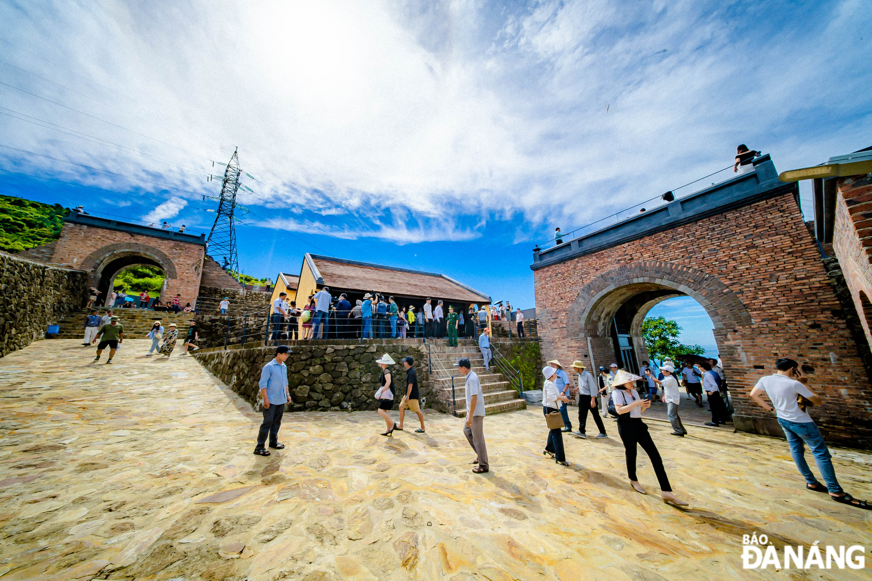 Visitors to a house in the Hai Van Gate relic site, a place for security guards to rest