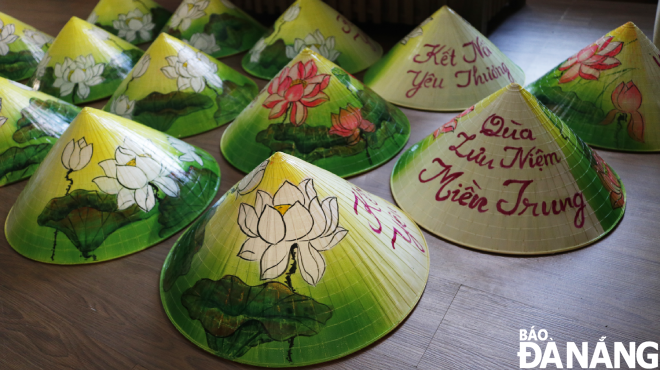 The finished conical hats are waiting to be delivered to customers. Men said that the number of orders usually increases in the summer and gradually decreases in the rainy season. Her customers are individuals, tour groups, businesses or organisations.