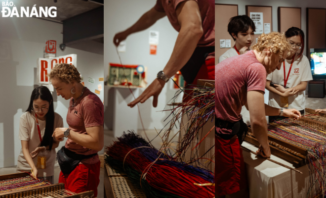  Foreign visitors experience weaving traditional Vietnamese mats, an activity within the framework of the exhibition.