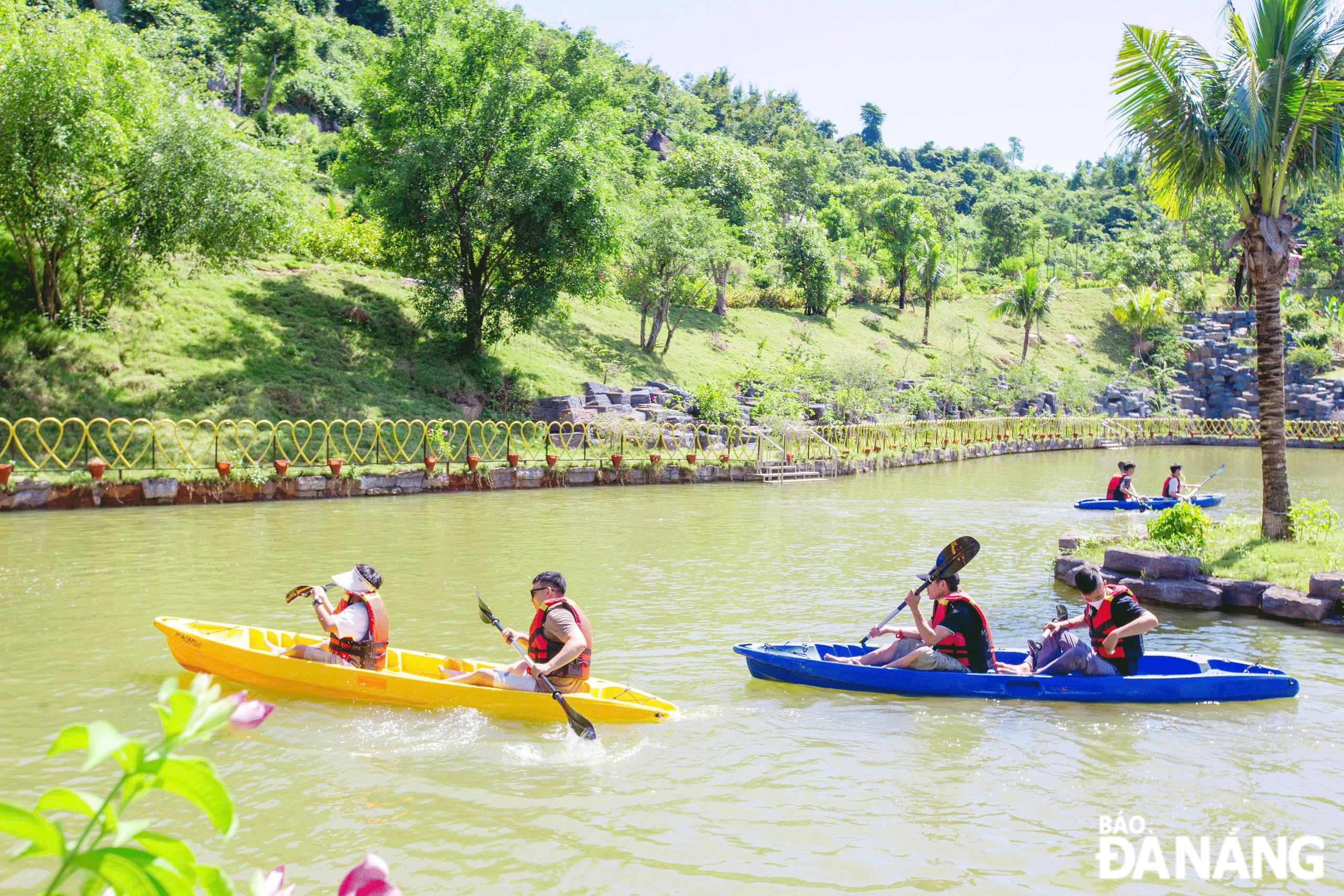 Many activities were organised to enhance the experience of visitors. IN PHOTO: Visitors experience rowing at the Nui Than Tai Hot Spring Park. Photo: THU HA