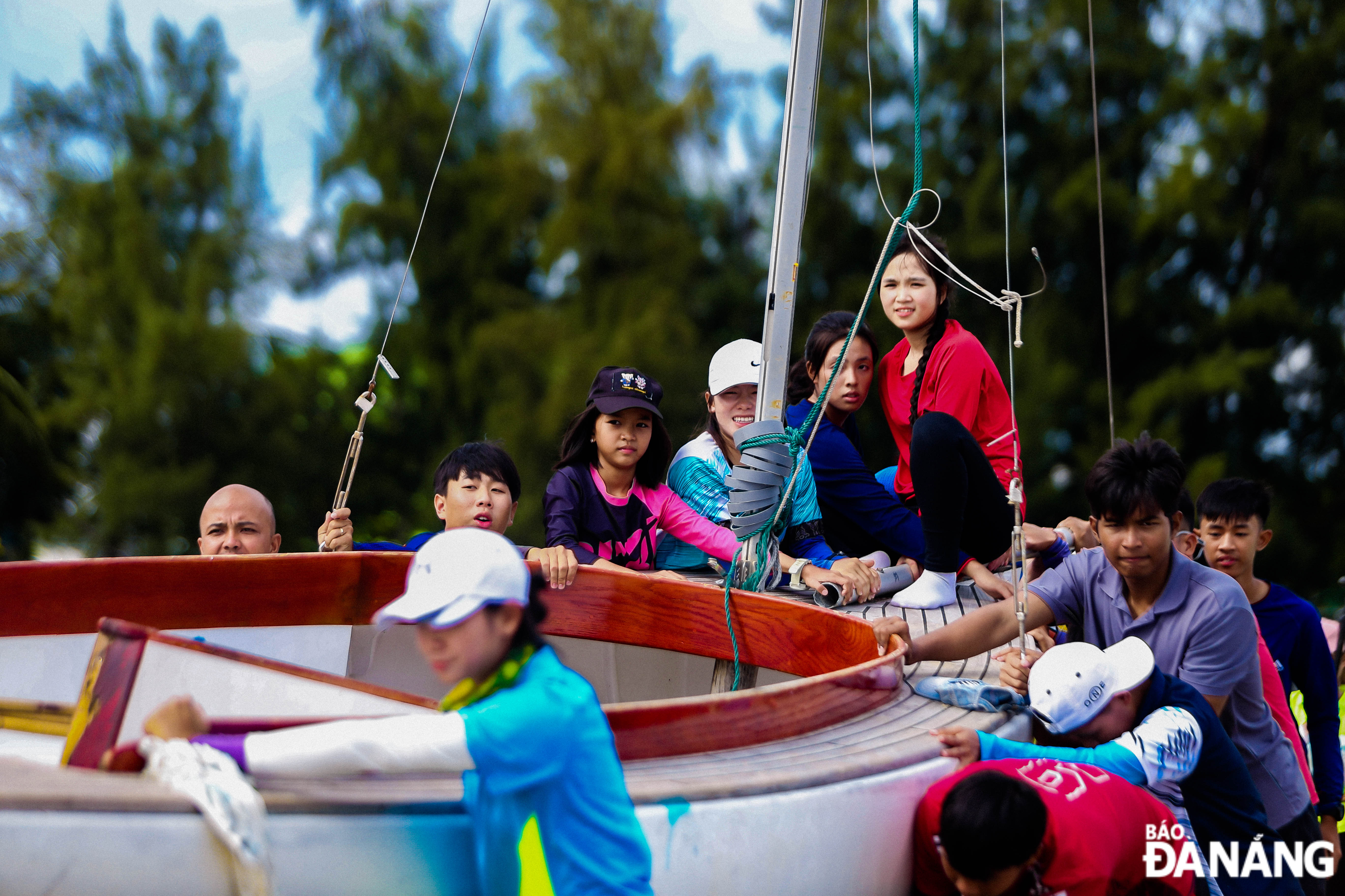 Athletes prepare to take their boats into the sea for the competition.