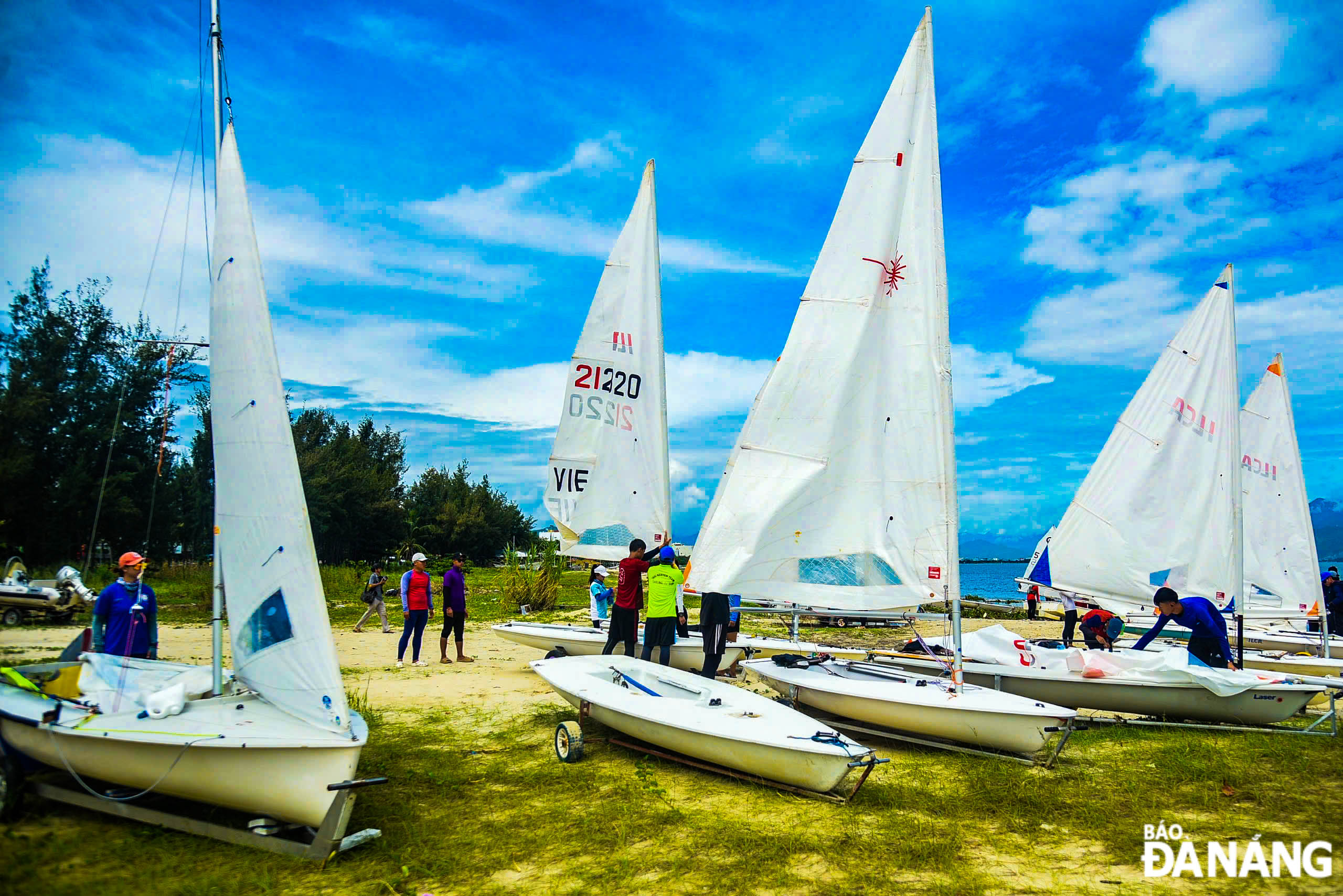 The teams prepare their sailboats for the competition.