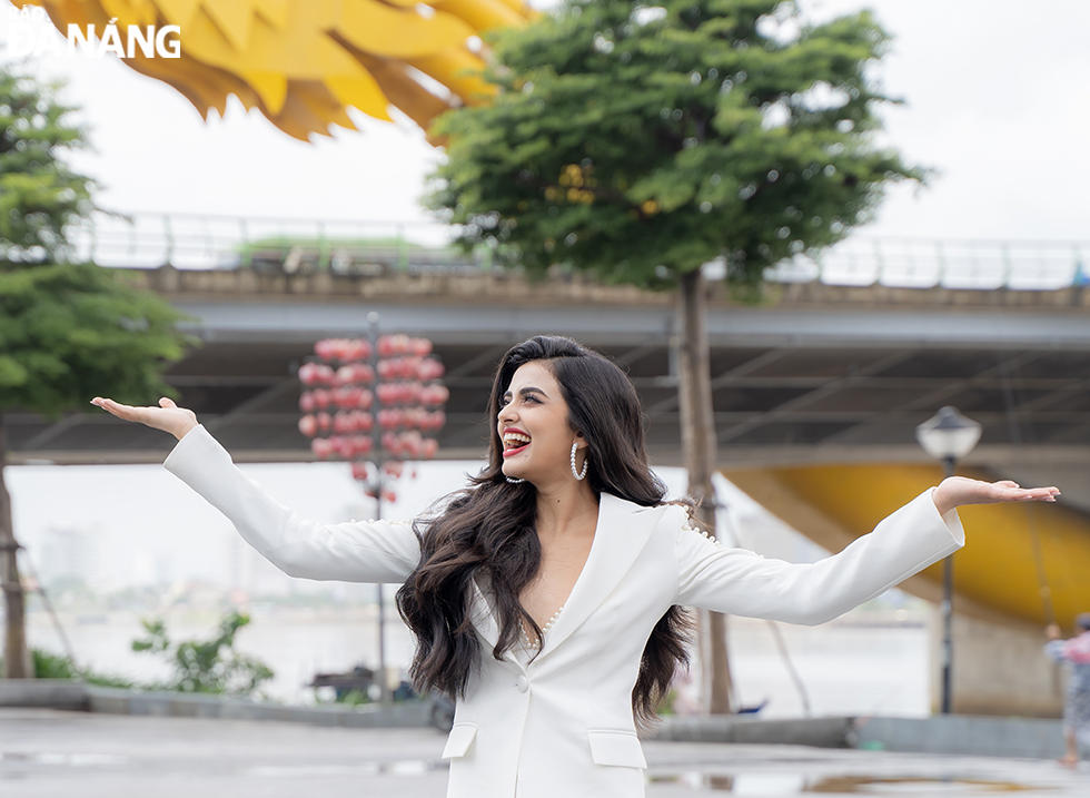 Miss Universe India Rhea Singha posing a check-in photo at the Dragon Bridge, an iconic symbol of Da Nang tourism.