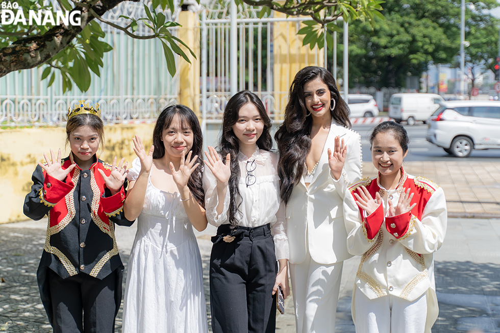 Miss Universe India Rhea Singha taking a photo with her fans