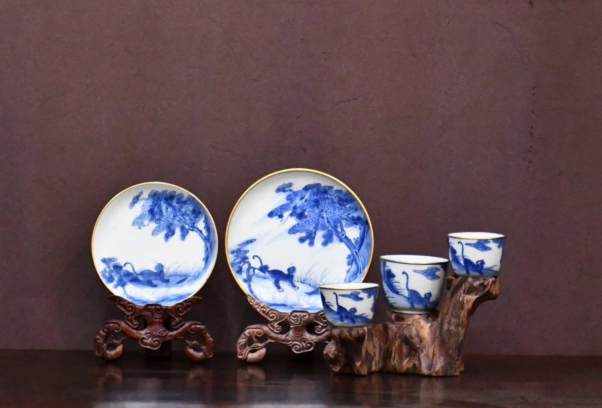 Tam Le has carefully curated a tea set decorated with a “Dragon and Tiger Battle” scene, marked 