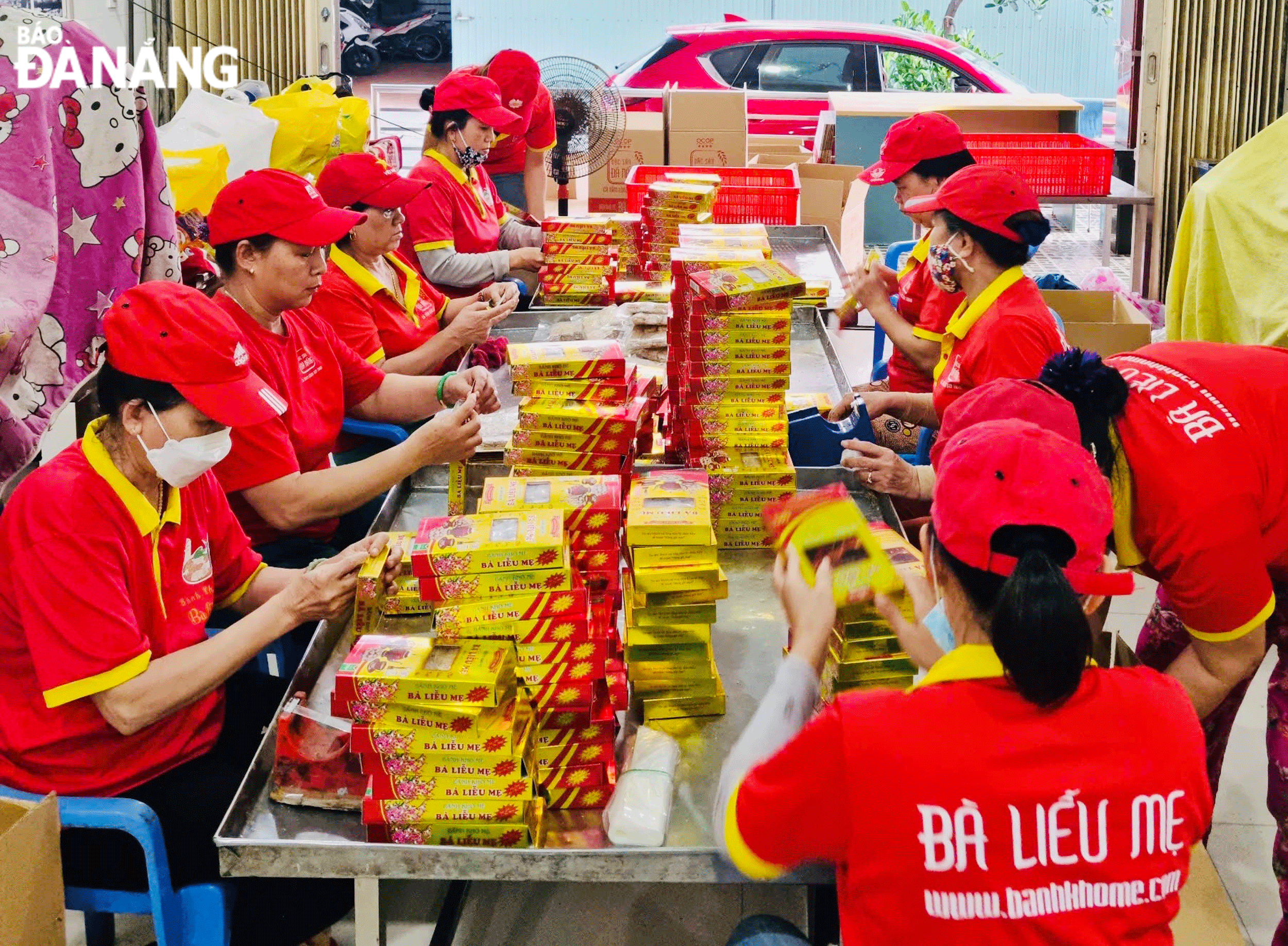 A 'banh kho me' (dried sesame seed cakes) production facility busying producing products for Tet. Photo: MAI LY