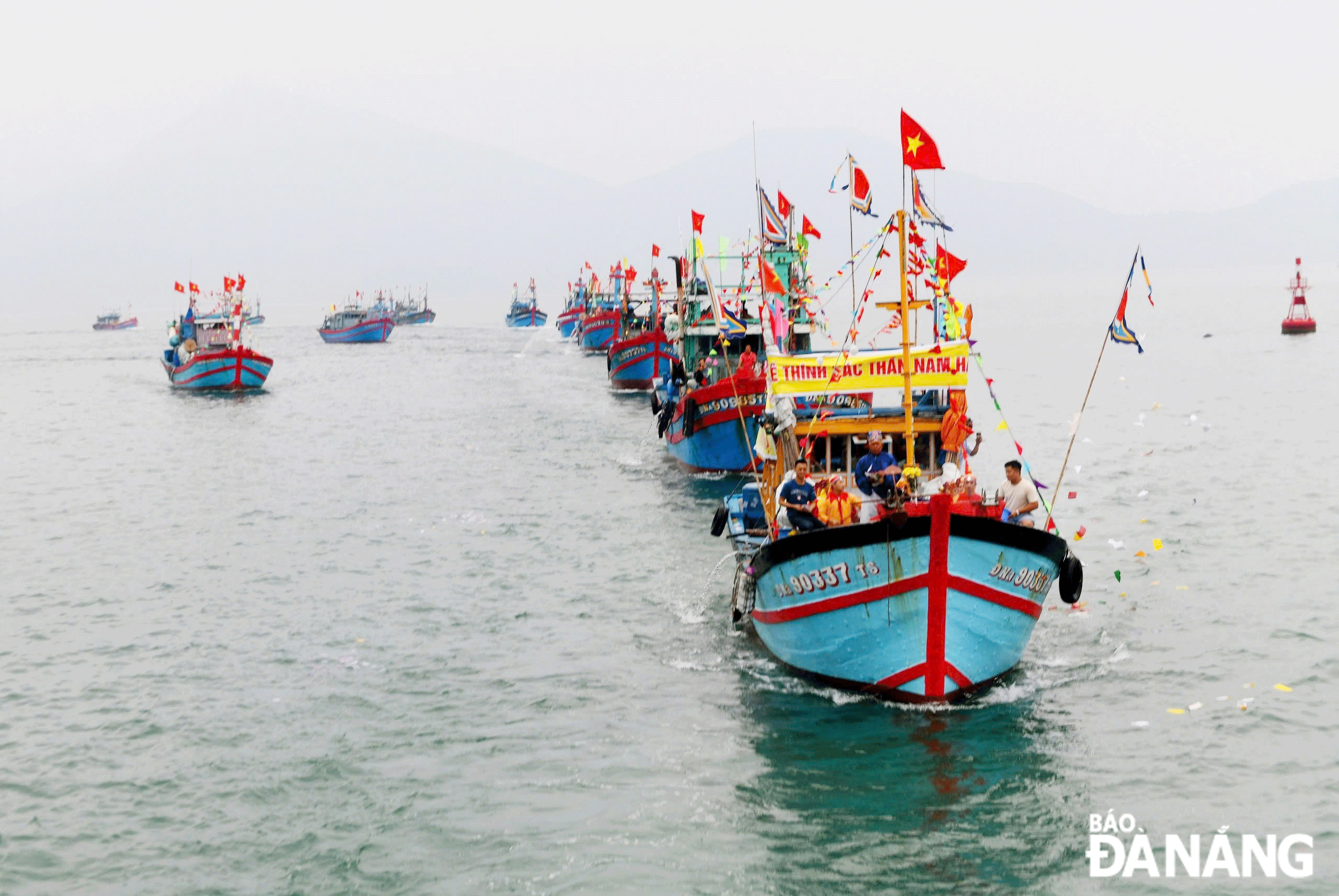 A fishing fleet during the Lunar New Year's Cau Ngu (Whale Worshiping) Festival organised by authorities in Nai Hien Dong Ward, Son Tra District, Da Nang. Photo: NGUYEN XUAN TU