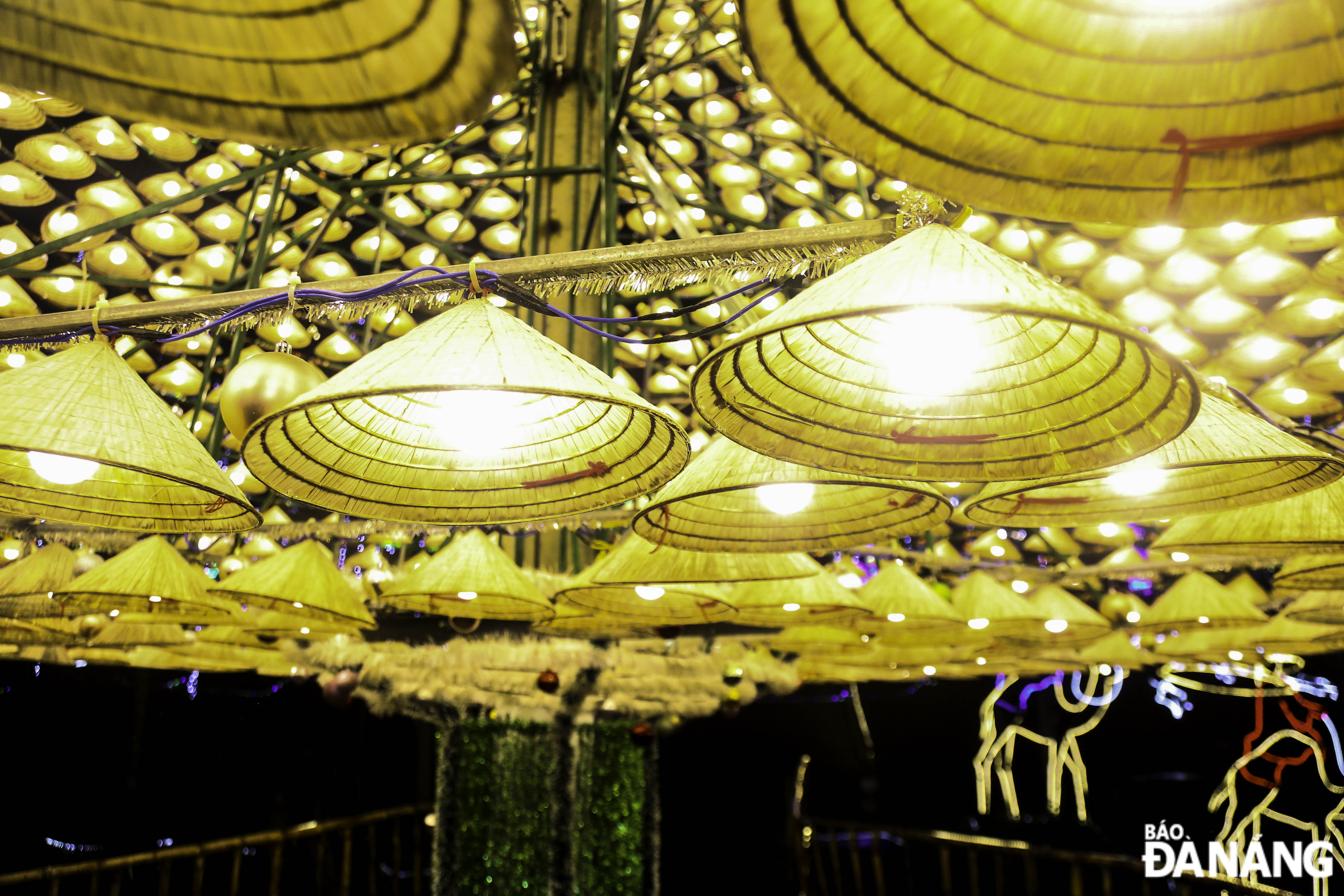 The conical hats decorated with lights look very eye-catching.