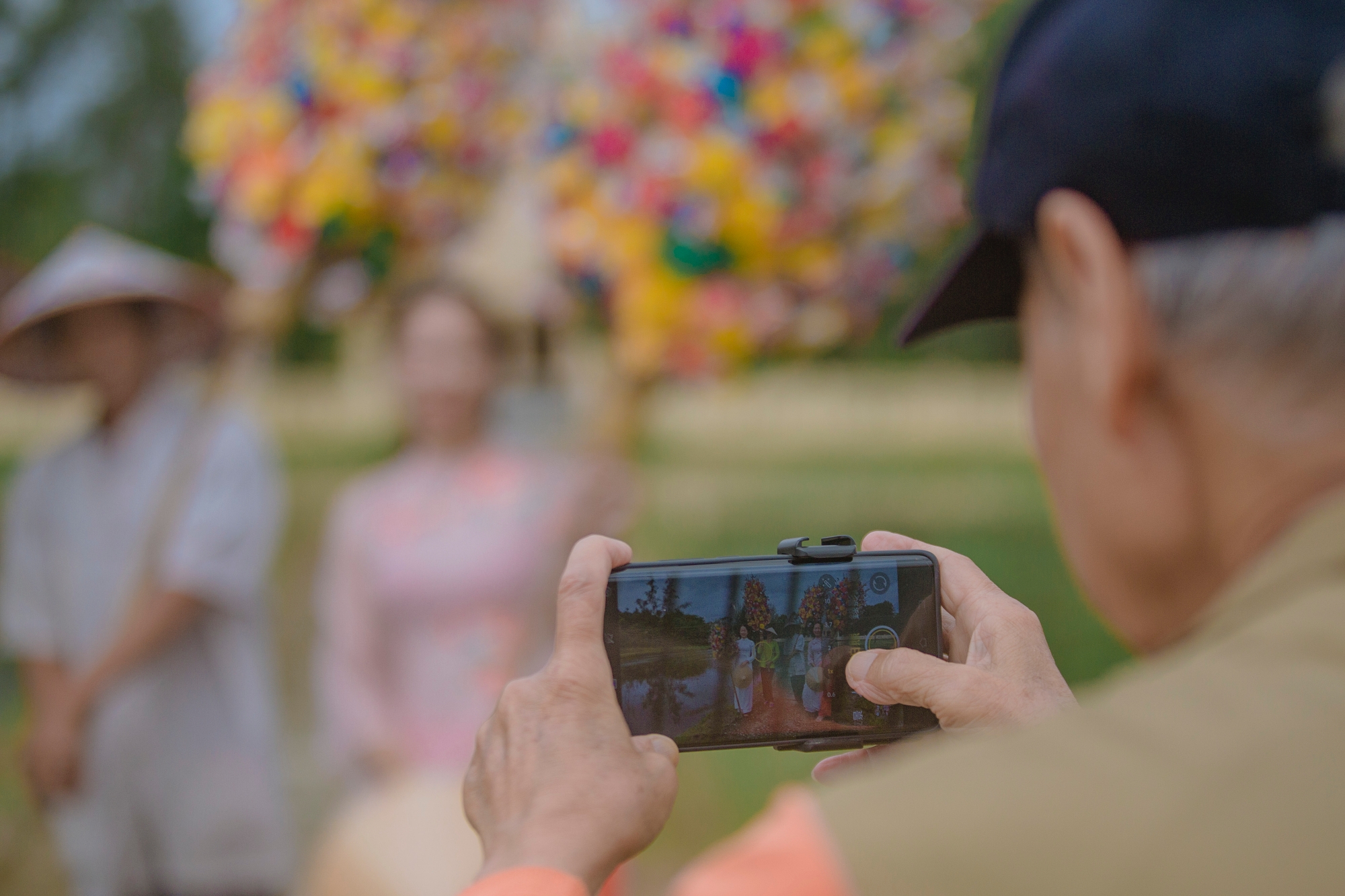 Visitors eagerly capture the beauty of the paper flower trees...