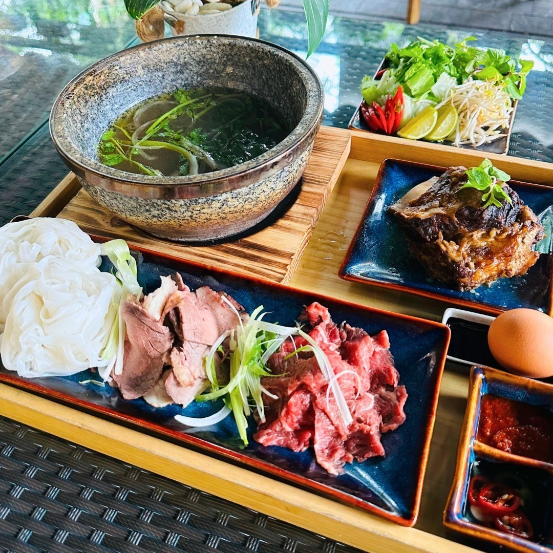 Eating pho in stone bowl in Da Nang