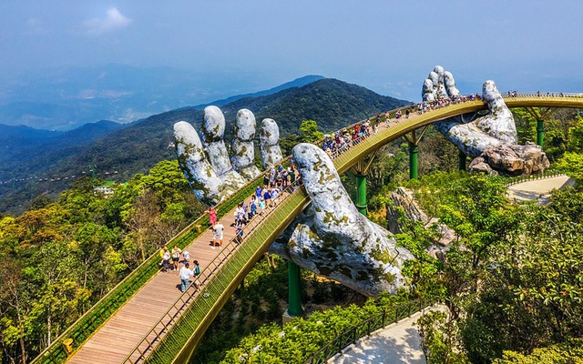 The Da Nang Golden Bridge perches on a prime location inside the Sun World Ba Na Hills Tourist Area, a fascinating entertainment and tourism complex of Da Nang - Illustration photo