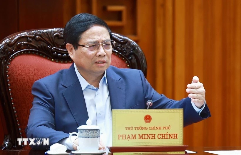 Thủ tướng Phạm Minh Chính chủ trì cuộc họp về mức áp thuế mới của Hoa Kỳ đối với hàng hóa nhập khẩu từ Việt Nam. (Ảnh: Dương Giang/TTXVN)